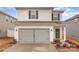Two-story house with gray siding, double garage, and landscaping at 226 J.P. Dr, Albemarle, NC 28001