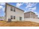 Two-story house with white siding, back patio, and AC unit at 226 J.P. Dr, Albemarle, NC 28001