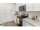 Kitchen features stainless steel appliances and white cabinets at 226 J.P. Dr, Albemarle, NC 28001