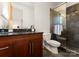 Clean bathroom with granite countertop, a toilet, and a shower stall at 4827 Camilla Dr, Charlotte, NC 28226