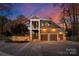 Stunning two-story home with stone accents and a three-car garage at 4827 Camilla Dr, Charlotte, NC 28226