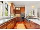 Modern kitchen featuring wood cabinetry and a large island at 4827 Camilla Dr, Charlotte, NC 28226