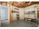 Unfinished basement with open ceiling and metal shelving for storage at 5022 Saybrook Dr, Harrisburg, NC 28075