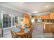 Kitchen with breakfast nook, island, and view into adjacent living area at 5022 Saybrook Dr, Harrisburg, NC 28075