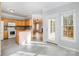 Bright eat-in kitchen with wood cabinets and stainless appliances at 5022 Saybrook Dr, Harrisburg, NC 28075