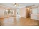 Bright living room with hardwood floors and large windows at 5022 Saybrook Dr, Harrisburg, NC 28075