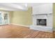 Bright, open basement area featuring a fireplace and glass doors leading to outdoor space at 6726 Wannamaker Ln, Charlotte, NC 28226