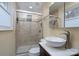 Bathroom features a glass-enclosed shower, modern sink, and light colored tile at 6726 Wannamaker Ln, Charlotte, NC 28226