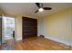 The yellow bedroom includes hardwood floors, and a modern closet at 6726 Wannamaker Ln, Charlotte, NC 28226