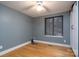 Bedroom with hardwood floors, natural light, and a ceiling fan at 6726 Wannamaker Ln, Charlotte, NC 28226
