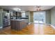 Bright kitchen featuring stainless steel appliances, a center island, and access to an outdoor deck at 6726 Wannamaker Ln, Charlotte, NC 28226