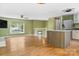 Open living space flows into the kitchen with modern stainless steel appliances and a convenient island at 6726 Wannamaker Ln, Charlotte, NC 28226