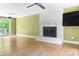 Spacious living area with a fireplace and sliding glass doors that lead to a deck or patio at 6726 Wannamaker Ln, Charlotte, NC 28226