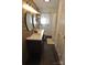 Modern bathroom with double vanity, wood-look floors, and walk-in shower at 733 Azalea Dr, Chester, SC 29706