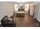 Spacious bedroom with wood-look flooring and a comfortable sitting area at 733 Azalea Dr, Chester, SC 29706