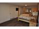 Main bedroom with a large bed, dresser, and dark hardwood floors at 733 Azalea Dr, Chester, SC 29706