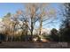 Single-story home nestled amongst mature trees on a spacious lot at 733 Azalea Dr, Chester, SC 29706