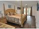 Large main bedroom with a post bed, and access to the backyard at 733 Azalea Dr, Chester, SC 29706