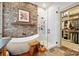 Spa-like bathroom with a freestanding tub and walk-in shower at 10439 Donahue Dr, Huntersville, NC 28078