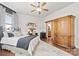 Spacious bedroom with a large armoire and comfortable bedding at 10439 Donahue Dr, Huntersville, NC 28078