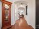 Bright entryway with hardwood floors and views to living area at 10439 Donahue Dr, Huntersville, NC 28078