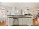 Kitchen island with granite countertop and stainless steel dishwasher at 10439 Donahue Dr, Huntersville, NC 28078