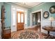 Elegant entryway features hardwood floors, a large door, and a circular rug at 106 N Battleground Ave, Kings Mountain, NC 28086