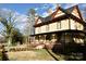 Two-story home with wraparound porch and landscaped yard at 106 N Battleground Ave, Kings Mountain, NC 28086