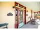 Charming front door with glass panels and rocking chairs on porch at 106 N Battleground Ave, Kings Mountain, NC 28086