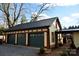 Detached three-car garage with dark green doors at 106 N Battleground Ave, Kings Mountain, NC 28086