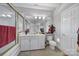 Bright bathroom featuring a large mirror, white vanity with cabinets, and a shower with glass doors at 115 Amelia Ln # 29, Mooresville, NC 28117