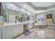 Elegant bathroom with double vanity, arched windows, and a luxurious soaking tub at 115 Amelia Ln, Mooresville, NC 28117