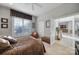 Bedroom with a view into the hallway, and including a shuttered window, neutral walls, and decor at 115 Amelia Ln, Mooresville, NC 28117