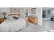 Bedroom with a wooden dresser and decoratively adorned walls as viewed from a queen bed at 115 Amelia Ln # 29, Mooresville, NC 28117