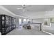 Upstairs hallway featuring a glass display cabinet, chair and windows with a view to the outside at 115 Amelia Ln, Mooresville, NC 28117