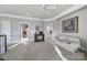 Upstairs hallway featuring a white couch, vintage TV and doors to other rooms in the house at 115 Amelia Ln # 29, Mooresville, NC 28117