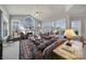 Living room with multiple windows offering natural light and a ceiling fan at 115 Amelia Ln, Mooresville, NC 28117