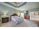 Spacious main bedroom with a decorative tray ceiling and natural light at 115 Amelia Ln, Mooresville, NC 28117