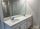 Bathroom with double vanity and a large mirror at 115 Obadiah Ct, Troutman, NC 28115