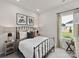 Cozy bedroom with a metal bed frame and neutral color palette at 115 Obadiah Ct, Troutman, NC 28115