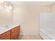 Clean bathroom with a tub, vanity, and tile floor at 119 Heritage Creek Dr, Hickory, NC 28601
