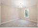 Spacious bedroom with carpet, large window, and chandelier at 119 Heritage Creek Dr, Hickory, NC 28601