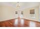 Large bedroom with hardwood floors, chandelier, and abundant natural light at 119 Heritage Creek Dr, Hickory, NC 28601