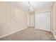 Bedroom with carpet, double doors, and chandelier at 119 Heritage Creek Dr, Hickory, NC 28601