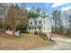 Two-story house with a brick-and-vinyl exterior, a white picket fence, and a spacious yard at 119 Heritage Creek Dr, Hickory, NC 28601