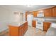 Kitchen boasts oak cabinets, an island, and modern appliances at 119 Heritage Creek Dr, Hickory, NC 28601
