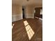 Bright living room with hardwood floors and views into adjacent dining room and kitchen at 119 Heritage Creek Dr, Hickory, NC 28601