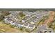 Aerial view showcasing a residential neighborhood with manicured lawns and community pool at 13312 Chopin Ridge Rd, Huntersville, NC 28078