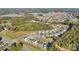 Expansive aerial view of a well-planned community, showcasing lush greenery and neatly arranged homes in a suburban setting at 13312 Chopin Ridge Rd, Huntersville, NC 28078