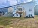 Spacious backyard with newly installed sod and a private wooden deck, ready for outdoor entertaining at 13312 Chopin Ridge Rd, Huntersville, NC 28078